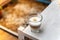 A cup of coffee on wooden table with work break time, food concept. Close up of a glass of hot Coffee Latte with nice milk form