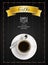 Cup of coffee with yellow ribbon and spoon on dark wooden background