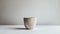 a cup crafted from minerals, set against a pristine white background for a striking contrast.