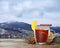 Cup with delicious mulled wine and spices on background of winter mountains.