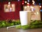 Cup with drink on the table in the cafe, fir branches, pillows. Christmas background