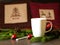 Cup with drink on the table in the cafe, fir branches, pillows. Christmas background