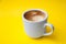 Cup of espresso isolated on yellow backround