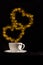 Cup with fantasy golden double heart shape steam