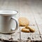 Cup of fresh milk and some homemade baked oat cookies on rustic wooden table background