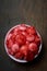 cup full of jambu or rose apple on table top