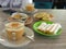 Cup of Gayo coffee and some typical Aceh snacks on the table