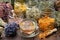 Cup of healthy calendula tea, Jars of dry medicinal herbs - heather, calendula, coneflowers, melissa, linden tree flowers.