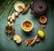 Cup of healthy herbal turmeric tea with ingredients. Top view
