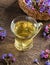 A cup of herbal tea with fresh blooming lungwort plant