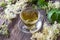 A cup of herbal tea with fresh meadowsweet