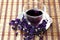 Cup of herbal tea of mauve flowers dry