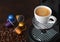 Cup with hot aroma coffee from espresso machine pods on dark background