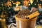 Cup of hot chocolate with a Christmas theme, a typical drink for the holidays. Spot focus on cinnamon, background with christmas