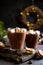 Cup of hot chocolate with marshmallows on top and winter decor. Traditional drink for autumn or winter holidays