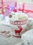 Cup with hot chocolate with polar bear marshmallow face with Christmas presents decorations