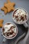 Cup of Hot chocolate with whipped cream on gray background. Gingerbread. Still life.