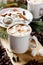 Cup of hot cocoa or chocolate with marshmallows on wooden background