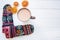 A cup of hot cocoa, dried oranges and Christmas ornament on white background