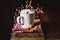 Cup of Hot Cocoa with Mini Marshmallows and Cookies on Red Napkin Old Wooden Background Beautiful Christmas Lights of Bokeh