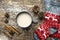 A cup of hot cocoa and red socks with Christmas ornament