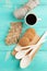 Cup of hot coffee assorted with cookies for breakfast on wooden vintage table.