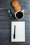 Cup of hot coffee assorted with cookies for breakfast on wooden vintage table.