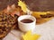 Cup hot of coffee autumn seasonal vintage autumn beverage leaves concrete background