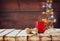 Cup of hot coffee and cozy knitted scarf on wooden table