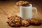 Cup with hot coffee and homemade backing chocolate cookies on a wooden table