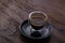 cup of hot espresso coffee shot on wooden table