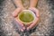 Cup of Hot Japanese Green Tea in the Palms of both Hands.