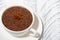 Cup of hot spiced chocolate on white background