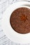 Cup of hot spiced chocolate on white background, vertical closeup