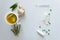 Cup of hot tea with ginger and rosemary. Pills, medicines and thermometer on a light background.