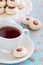 Cup of hot tea and homemade almond cookies