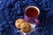 Cup of hot tea, oatmeal cookies and warm scarf