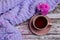 Cup of just made english tea with plaid and flowers. Romantic picture for cosy evening after working day