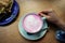 Cup of pink cappuccino