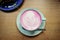 Cup of pink cappuccino