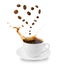 Cup with saucer with splash of coffee. Levitating coffee beans in shape of heart. Drink love concept