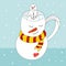 A cup in the shape of a snowman with a striped scarf, a small snowman sits inside the cup