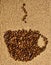 Cup-shaped coffee roasted beans on a knitted pattern in beige raffia. Hand knitted