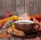 Cup of Steaming Coffee and Cookie on a Rustic Wooden Background