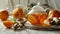 a cup of steaming hot ginger orange tea, accompanied by a glass teapot, slices of fresh ginger, and vibrant oranges