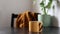 Cup of steaming hot tea in modern minimalistic style kitchen. Someone is in the kitchen and his her reflection is seen