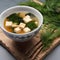 A cup of steaming miso soup with tofu and seaweed4