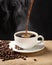 Cup of steamy coffee with smoke and coffee beans. Hot coffee on black background