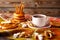 A cup of strong black tea with bagels, sugar, poppy sushki