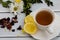Cup of tasty herbal tea with lemon